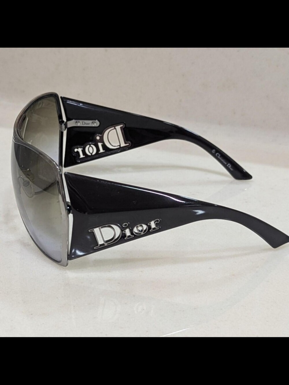 Authentic vintage Dior shield sunglasses in a sleek brown